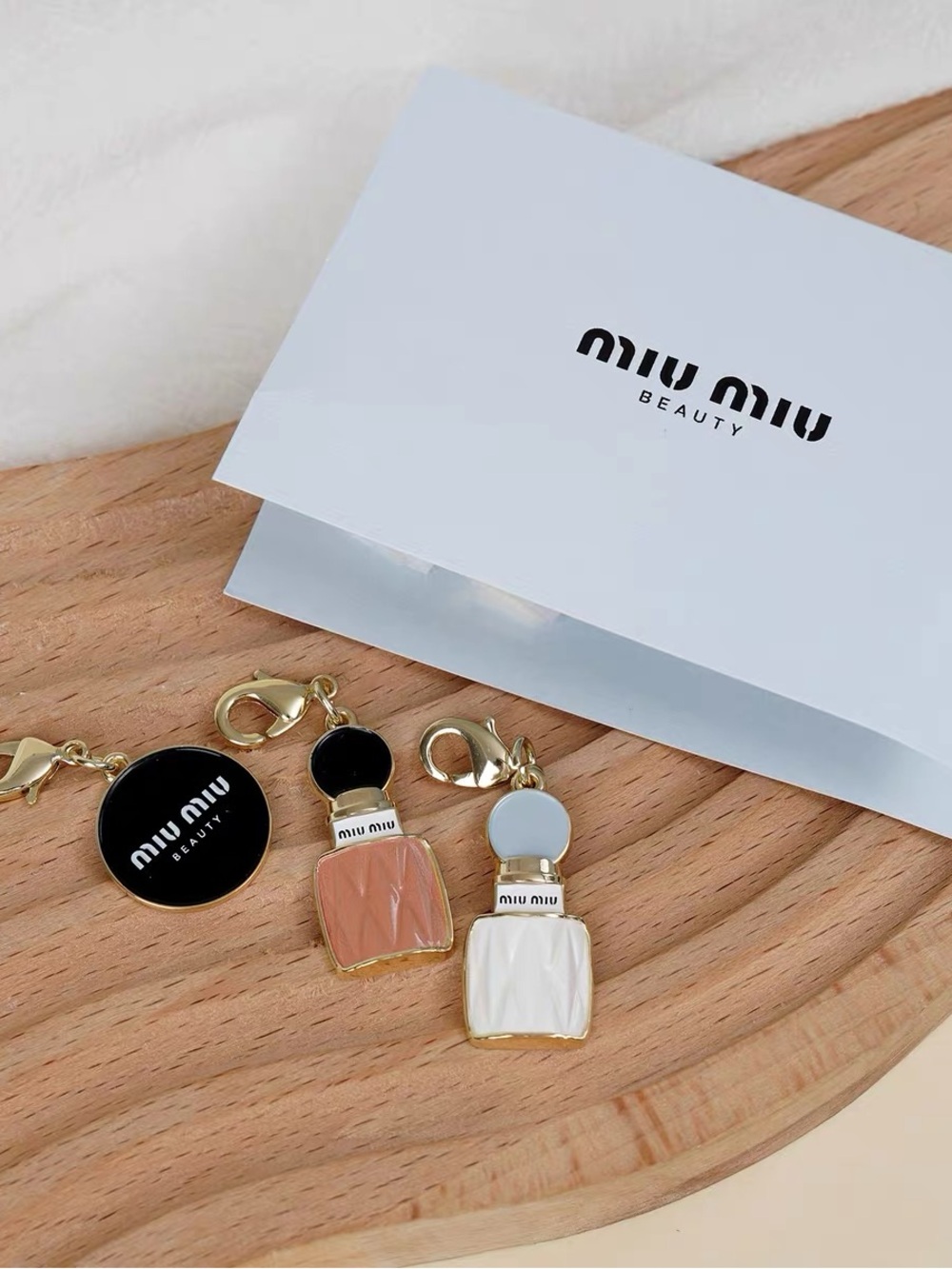 Miu Miu Peach & White Enamel Perfume Bottle Charm Keychain Set